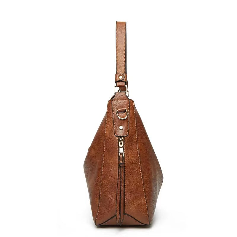 Caprielle - Elegant leather bag with large capacity and side pockets